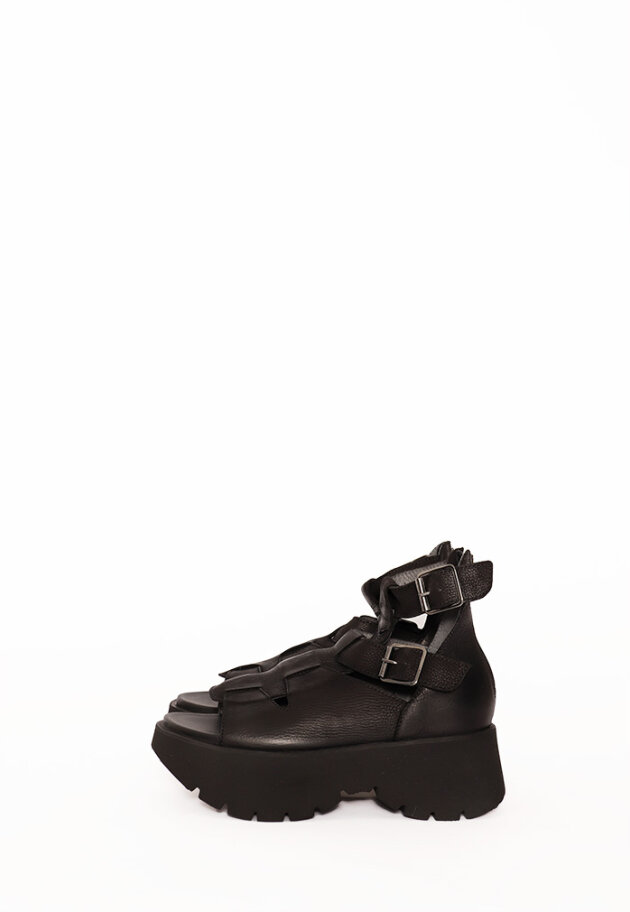 Sandal with a micro sole, zipper and buckles