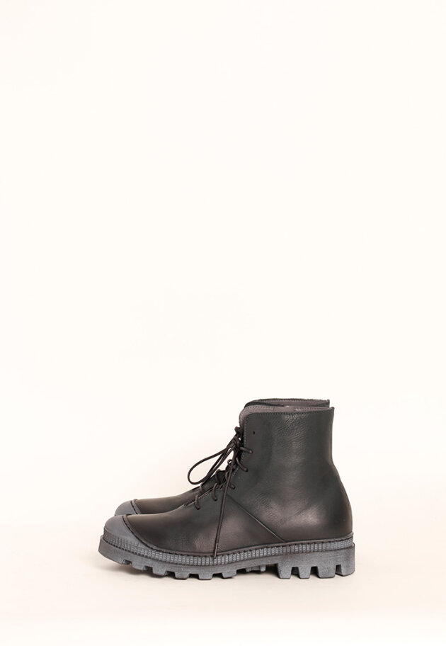 Boot with rubber sole and shoe lace