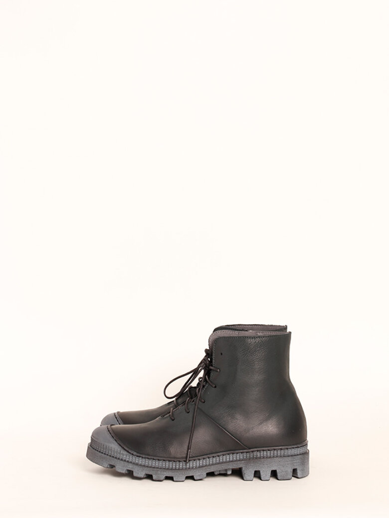 Boot with rubber sole and shoe lace