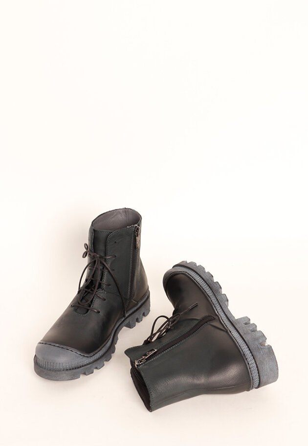 Boot with rubber sole and shoe lace