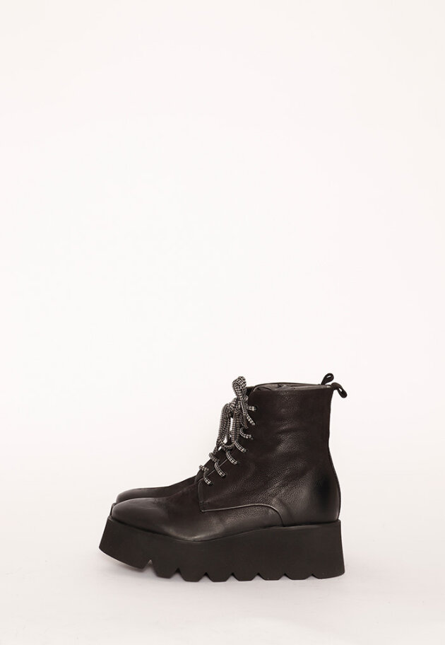 Boot with rubber sole and shoe lace