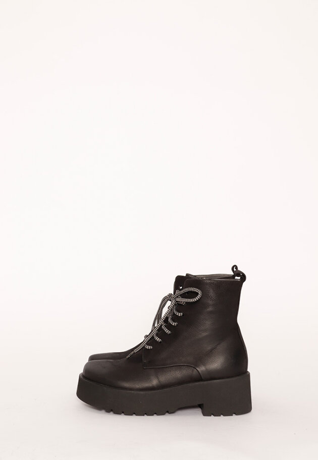 Boot with rubber sole and shoe lace