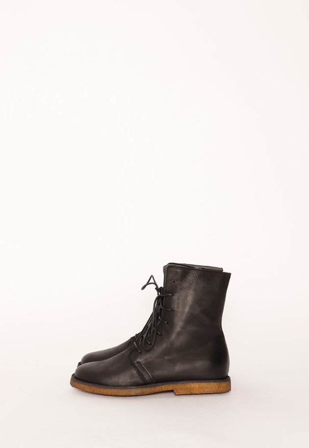 Bootie with a raw rubber sole