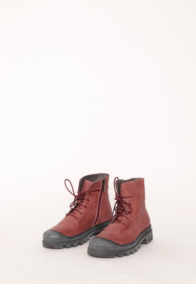 Boot with rubber sole and shoe lace