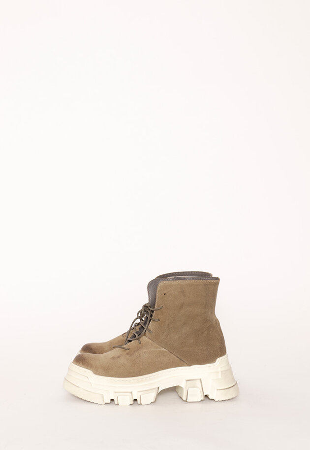 Bootie with a white chunky sole and laces